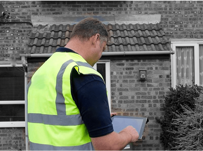 domestic EPC assessor carrying out a home energy assessment