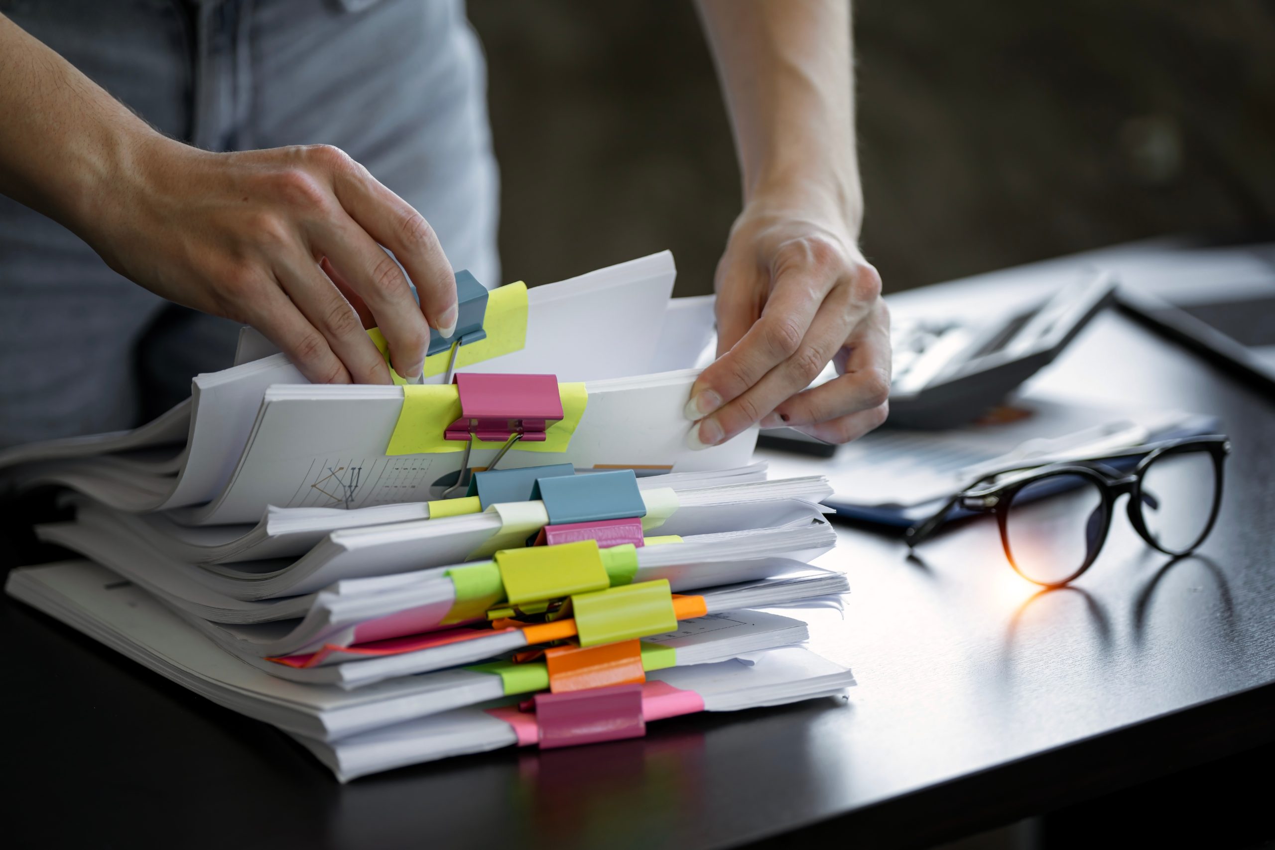 Landlord organising paper files for a MEES evidence file